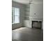Open living room with a fireplace, built-in shelving, and plenty of natural light at , Pittsboro, NC 27312