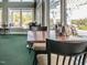 A bright and spacious restaurant featuring multiple tables and a view of the community at , Pittsboro, NC 27312