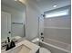 Modern bathroom featuring a shower-tub combination with sleek, matte black fixtures at 17 S Mistflower St, Clayton, NC 27520