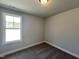 Well lit bedroom with neutral colors and large window showing ample natural light at 17 S Mistflower St, Clayton, NC 27520