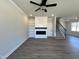 Inviting living room features a modern fireplace, built-in shelving, and ample natural light at 17 S Mistflower St, Clayton, NC 27520
