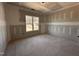 Unfinished bedroom featuring a window providing natural light, awaiting personalization and finishing touches at 182 Wilderness Trl, Smithfield, NC 27577
