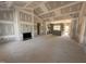 Spacious open-concept living room featuring fireplace and adjoined to kitchen with gray cabinets at 182 Wilderness Trl, Smithfield, NC 27577