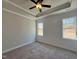 Bedroom with neutral carpet, tray ceiling and natural light from two windows at 20 S Mistflower St, Clayton, NC 27520