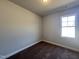 Bedroom with a carpeted floor and a large window at 20 S Mistflower St, Clayton, NC 27520