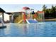 Community splash pad, colorful play structure with water features, promising endless fun for families at 20 S Mistflower St, Clayton, NC 27520