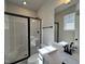 Bathroom with a glass-enclosed shower, and modern vanity with quartz countertop at 23 S Mistflower St, Clayton, NC 27520