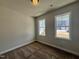 Bedroom with carpet flooring and two windows offering lots of natural light at 23 S Mistflower St, Clayton, NC 27520