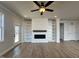 Living room with a fireplace, built-in shelves, and ample natural light from a sliding door at 23 S Mistflower St, Clayton, NC 27520