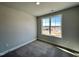 This bedroom is well-lit with carpeted floors and a window offering nice outside views at 232 Bluejay St, Clayton, NC 27520