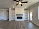 Spacious living room with fireplace, built-in shelving, and modern flooring at 238 Bluejay St, Clayton, NC 27520