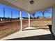 Covered back patio with view of grassy backyard at 32 S Mistflower St, Clayton, NC 27520