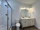 Double vanity bathroom with a large shower at 32 S Mistflower St, Clayton, NC 27520