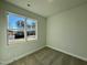 Simple bedroom with neutral decor and carpet flooring at 32 S Mistflower St, Clayton, NC 27520