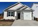 Craftsman style home with stone accents and a two-car garage at 32 S Mistflower St, Clayton, NC 27520