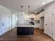 Modern kitchen with granite island and stainless steel appliances at 32 S Mistflower St, Clayton, NC 27520