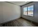 A cozy room with hardwood flooring, large windows, and fresh neutral paint at 35 S Mistflower St, Clayton, NC 27520