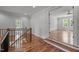 Second story hallway with wood floors leading to various rooms at 65 Cherry Bark Dr, Youngsville, NC 27596