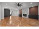Spacious living room boasts hardwood floors, fireplace and modern design elements for a comfortable and elegant space at 65 Cherry Bark Dr, Youngsville, NC 27596