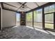 Cozy screened porch featuring stone floors, a brick fireplace, and views of the outdoors at 65 Cherry Bark Dr, Youngsville, NC 27596