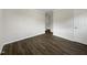 Bedroom with neutral paint and hard surface floors with a closet in the background at 225 W Orange St, Hillsborough, NC 27278