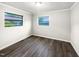 A vacant bedroom with new flooring, and natural lighting creates a cozy retreat at 225 W Orange St, Hillsborough, NC 27278