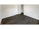 Bedroom with neutral paint, hard surface floors, and a double door closet at 225 W Orange St, Hillsborough, NC 27278