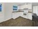 Bright kitchen featuring white cabinets and appliances, with ample counter space at 225 W Orange St, Hillsborough, NC 27278