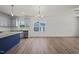 Open dining area with hardwood floors and chandelier at 63 Falls River Ct, Broadway, NC 27505