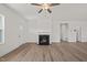 Bright and airy living room showcasing a cozy fireplace and neutral walls at 63 Falls River Ct, Broadway, NC 27505