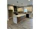 Beautiful kitchen featuring a large island, modern cabinetry, sleek appliances, and plenty of counter space at 2829 Faucette Ln, Burlington, NC 27217