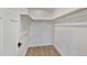 Spacious closet with wood shelving and hanging rods at 509 Sherron Rd # 9, Durham, NC 27703