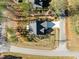 Bird's-eye view of the home, showcasing the roof, driveway, and surrounding landscaping at 100 Carol Cir, Louisburg, NC 27549