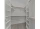 Walk-in closet with built in shelves and ample storage space at 100 Carol Cir, Louisburg, NC 27549