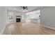 Bright living room with fireplace and hardwood floors that flows into the kitchen at 100 Carol Cir, Louisburg, NC 27549