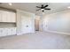 Large carpeted bedroom has built-in cabinets, storage, ceiling fan, and a connecting doorway for privacy at 123 Cottage Way, Pittsboro, NC 27312