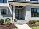 Home exterior showing the entrance with a covered front porch at 123 Cottage Way, Pittsboro, NC 27312