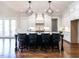 Bright kitchen with a large center island, pendant lighting, and a suite of stainless steel appliances at 123 Cottage Way, Pittsboro, NC 27312