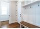 Well-organized mudroom with storage bench, coat hooks, and access to the main living area at 123 Cottage Way, Pittsboro, NC 27312