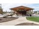 Community picnic pavilion with tables and greenery along a concrete path at 123 Cottage Way, Pittsboro, NC 27312