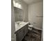 Bathroom featuring a single sink vanity with modern fixtures and tiled floor at 28 Decatur Dr, Fuquay Varina, NC 27526