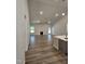 Open-concept living room with fireplace, recessed lighting, fan, and access to the outdoors at 28 Decatur Dr, Fuquay Varina, NC 27526