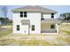 Two-story home with white siding, gray roof, and well-maintained lawn in a peaceful neighborhood at 42 Decatur Dr, Fuquay Varina, NC 27526