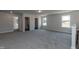 Large room with doorways to bath, closet, and storage space at 42 Decatur Dr, Fuquay Varina, NC 27526