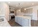Charming kitchen with gray cabinetry, granite counters and stainless steel appliances at 42 Decatur Dr, Fuquay Varina, NC 27526
