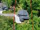 Stunning aerial view of a home nestled in a lush, green landscape with a private driveway at 5406 Garrett Rd, Durham, NC 27707