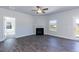 Bright living room showcasing a modern fireplace and a view of the backyard at 56 Decatur Dr, Fuquay Varina, NC 27526