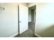 View of an open bedroom door leading into the room with neutral walls and carpet flooring at 66 Decatur Dr, Fuquay Varina, NC 27526