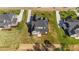 A stunning aerial view of the home showcasing the expansive lawn and well-manicured landscaping at 30 Spanish Oak Dr, Youngsville, NC 27596