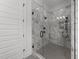 Modern marble bathroom features a large walk-in shower with black hardware at 30 Spanish Oak Dr, Youngsville, NC 27596